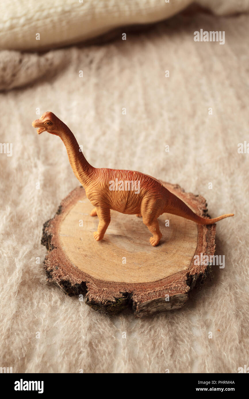 Dinosaur on a brown background, surreal concept, monochrome Stock Photo