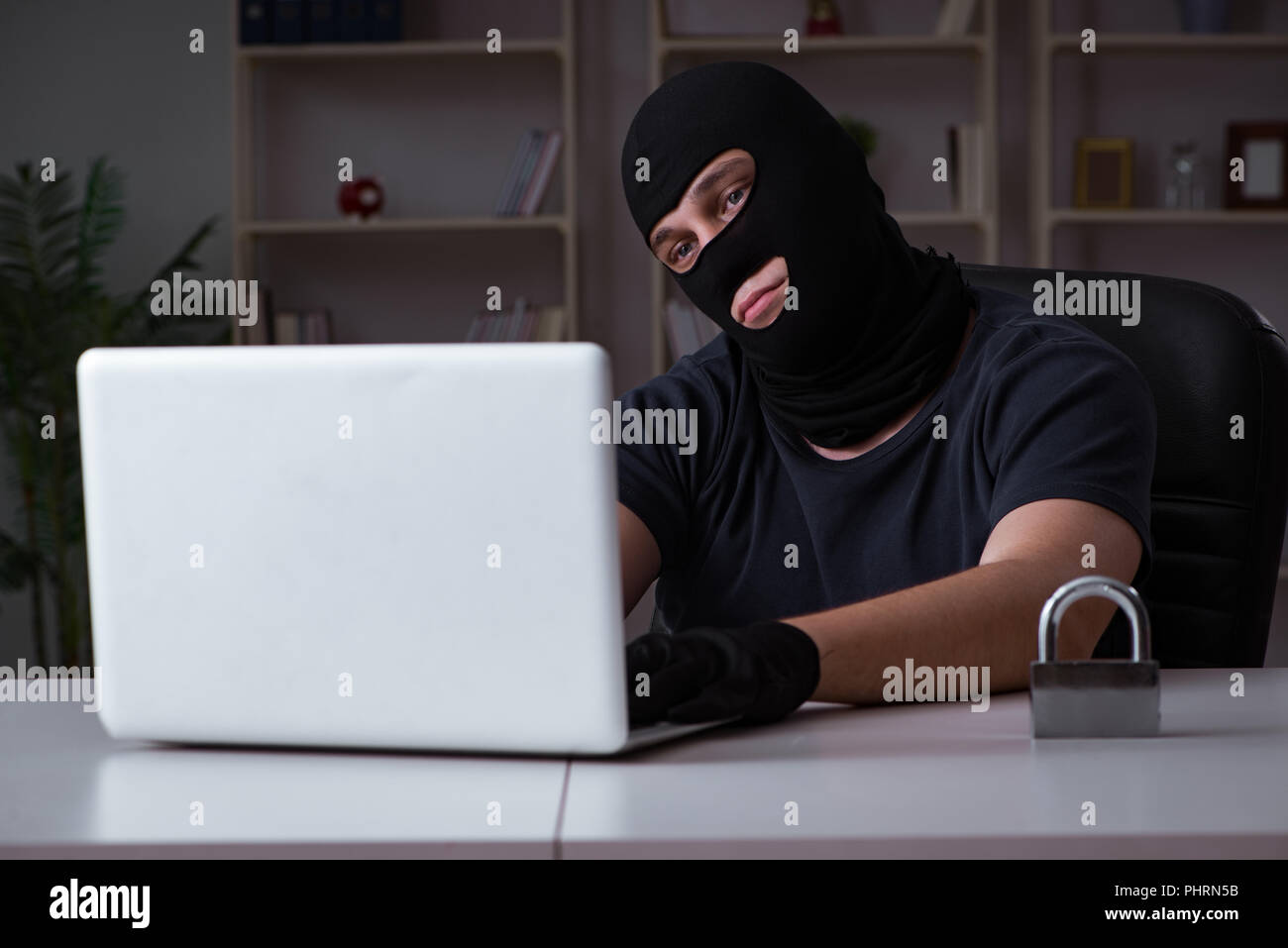 Hacker hacking computer late at night Stock Photo - Alamy