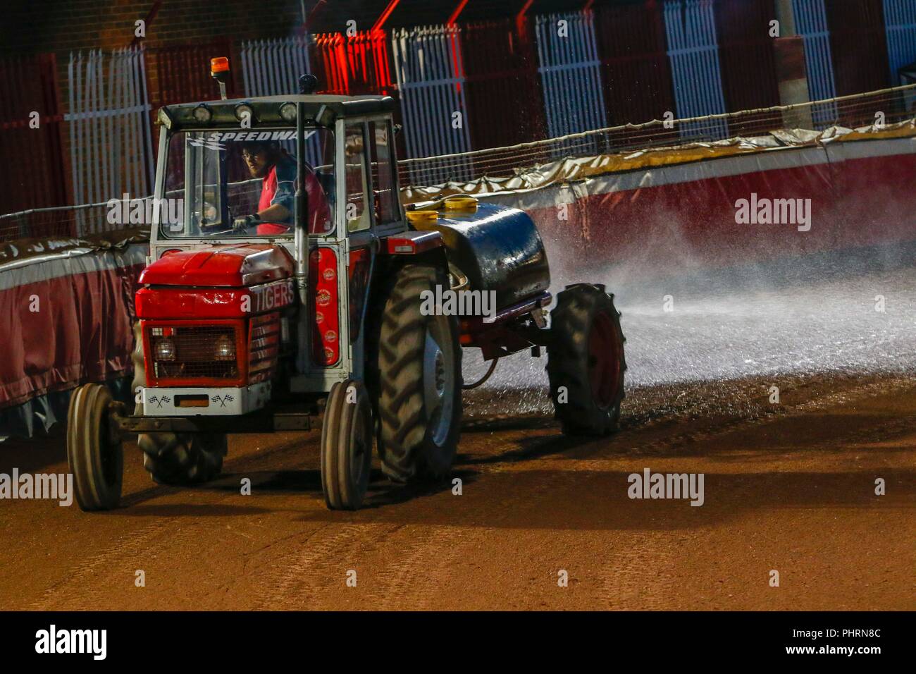 Damping down, staff work on the Ashfield track during the intival at the SGB National Championship meeting between Glasgow Tigers & Newcastle Diamonds Stock Photo