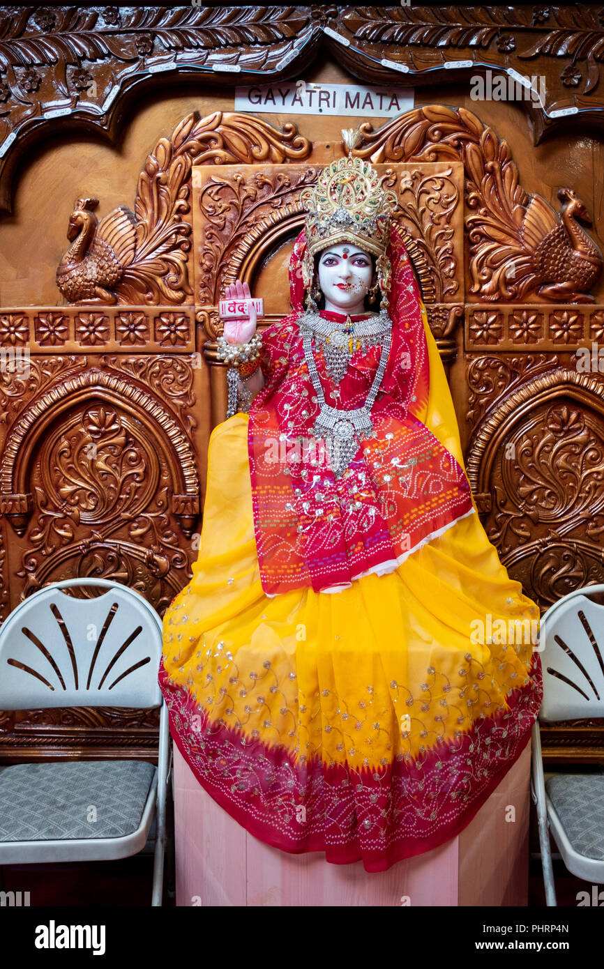A statue of deity Gayatri Mata at the altar inside the Geeta Temple in Corona, Queens, New York City Stock Photo