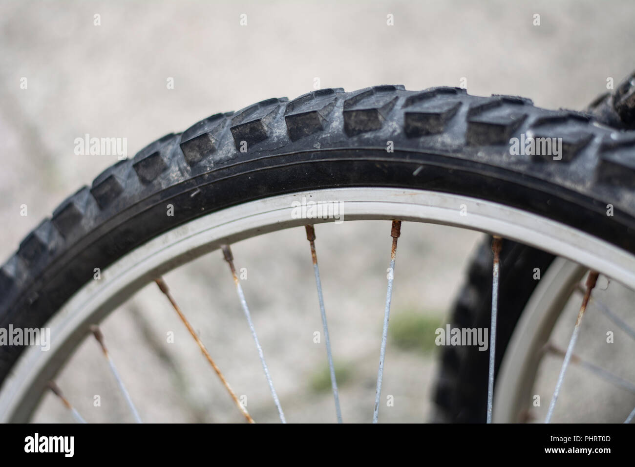 Close up of a mountain bike wheel with rusty spokes Stock Photo