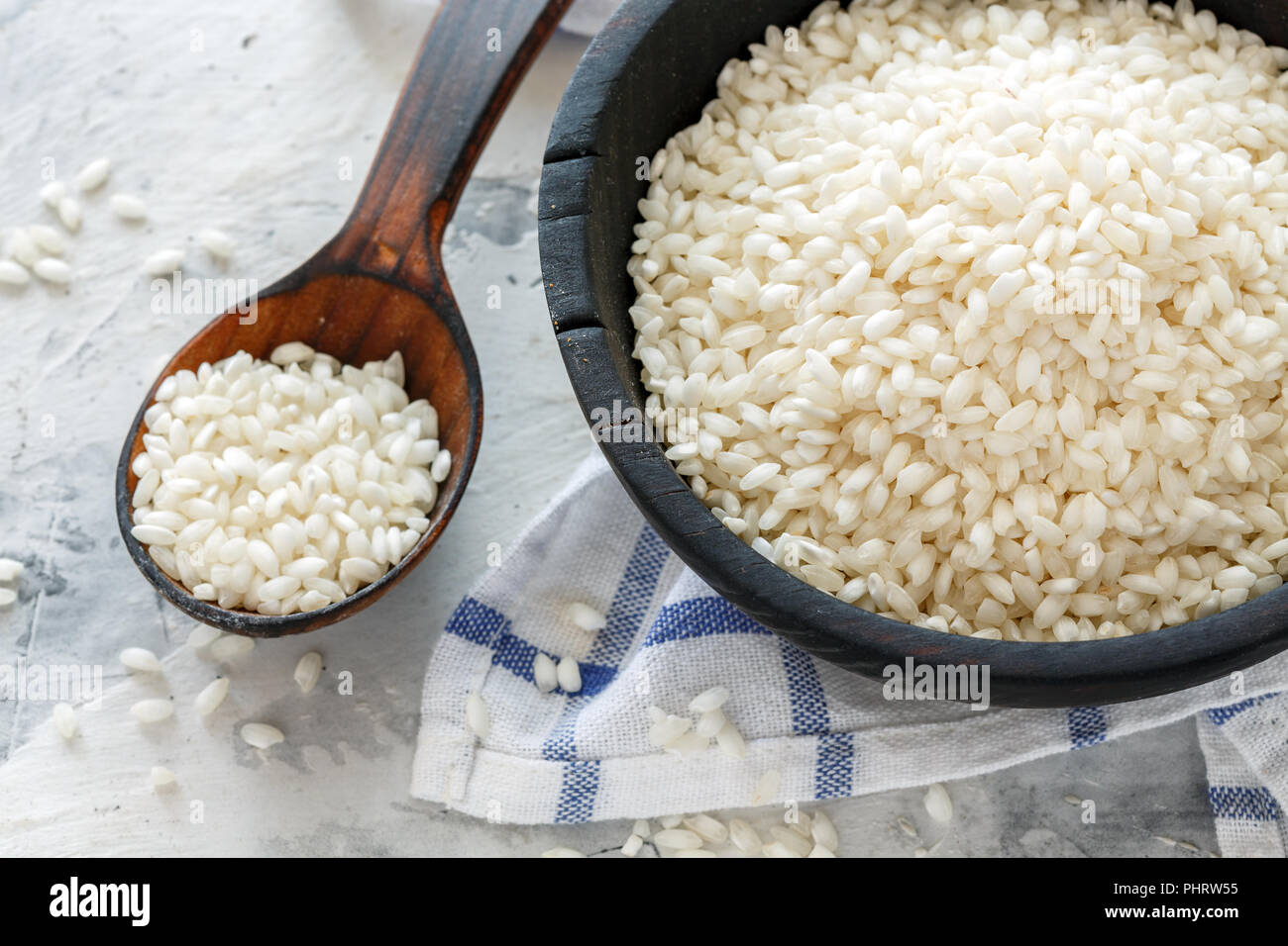 White round rice in a wooden bowl. Stock Photo