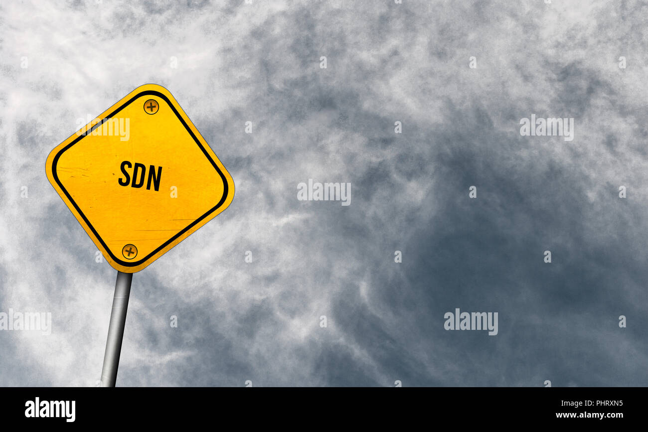 SDN - yellow sign with cloudy sky Stock Photo