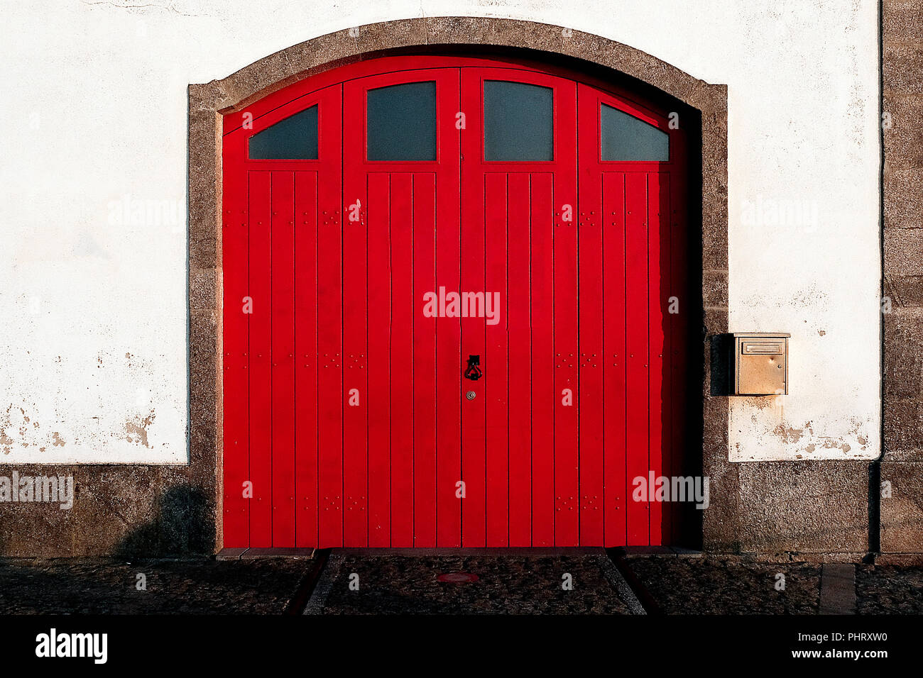 Red old door, sunlight Stock Photo