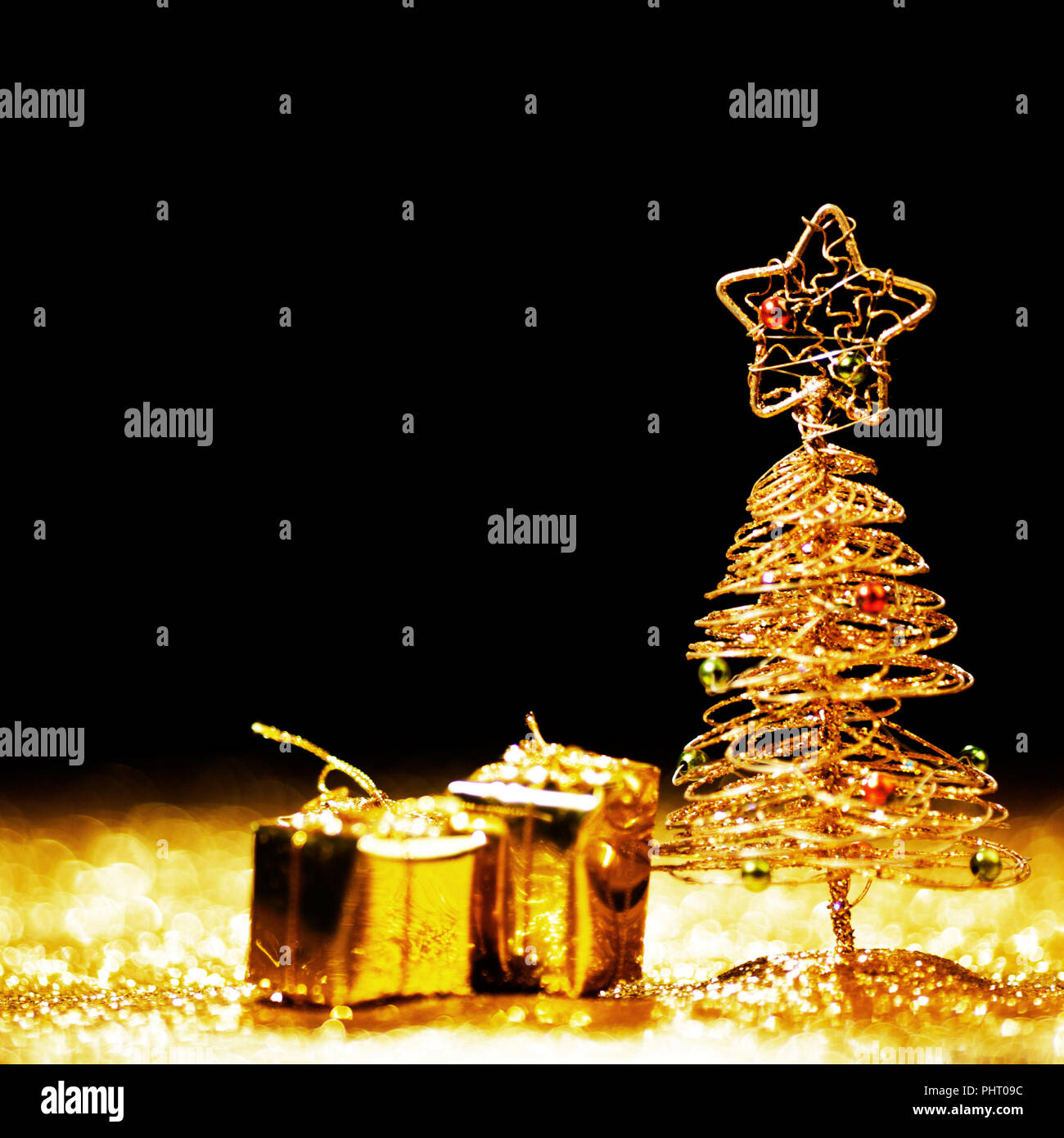 Toy golden decorative Christmas tree on glitter background Stock Photo ...