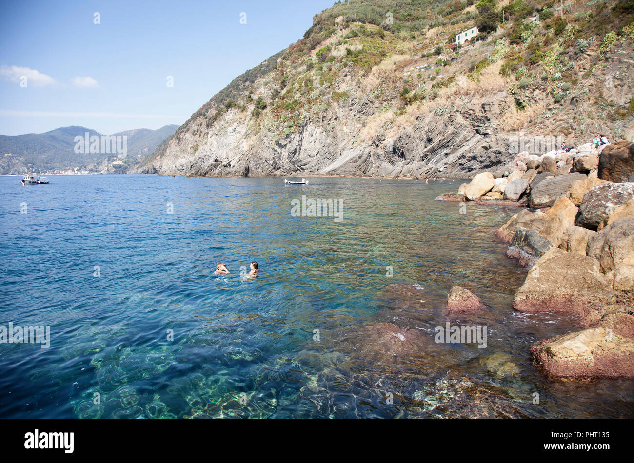 swimmers in the clear ocean at Vernazza Italy  cinque terre Stock Photo