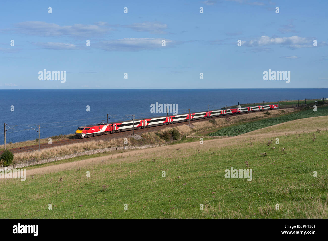A London North Eastern railway ( LNER ) class 91 electric at Lamberton crossing the