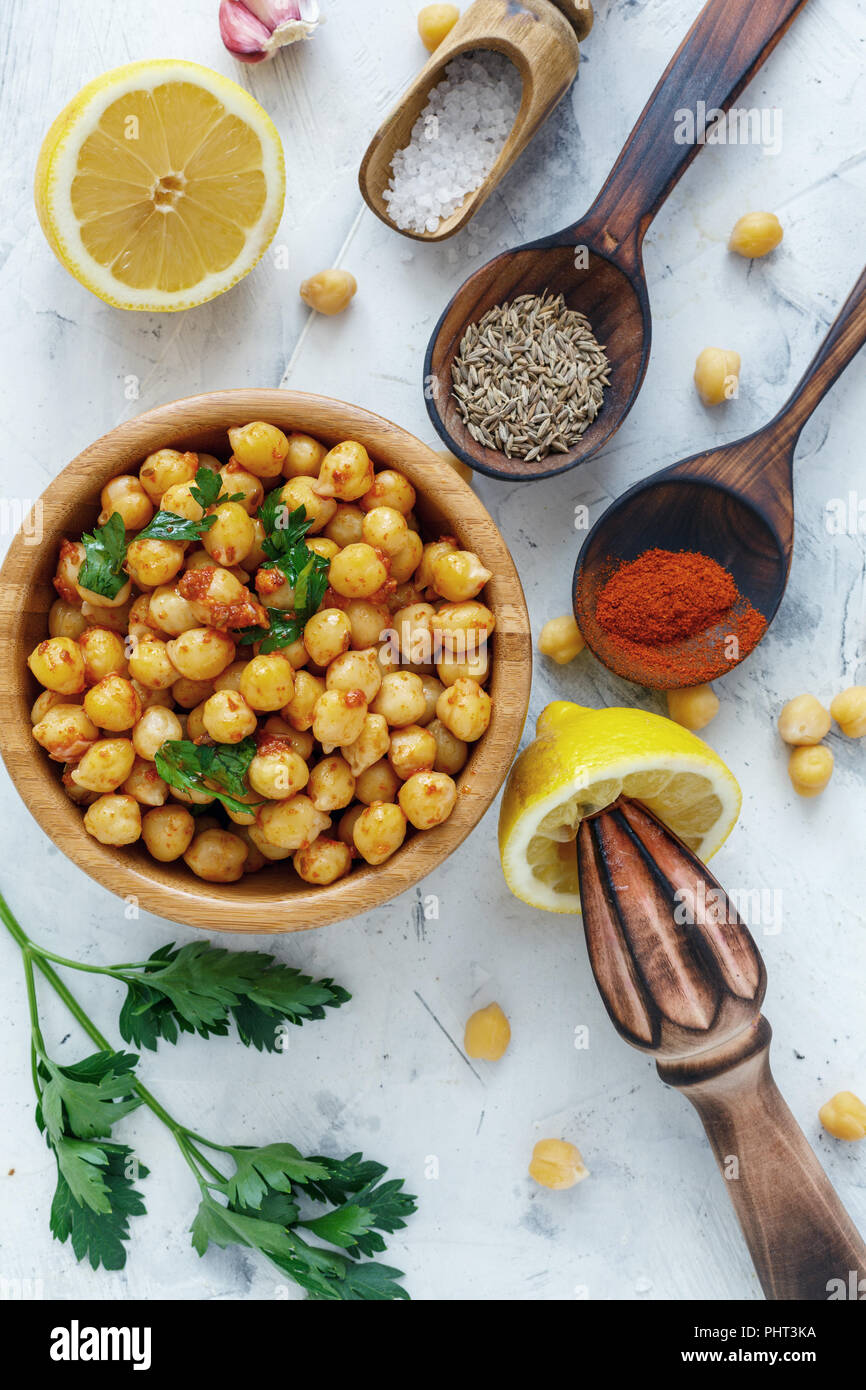 Spicy appetizer of boiled chickpeas. Stock Photo