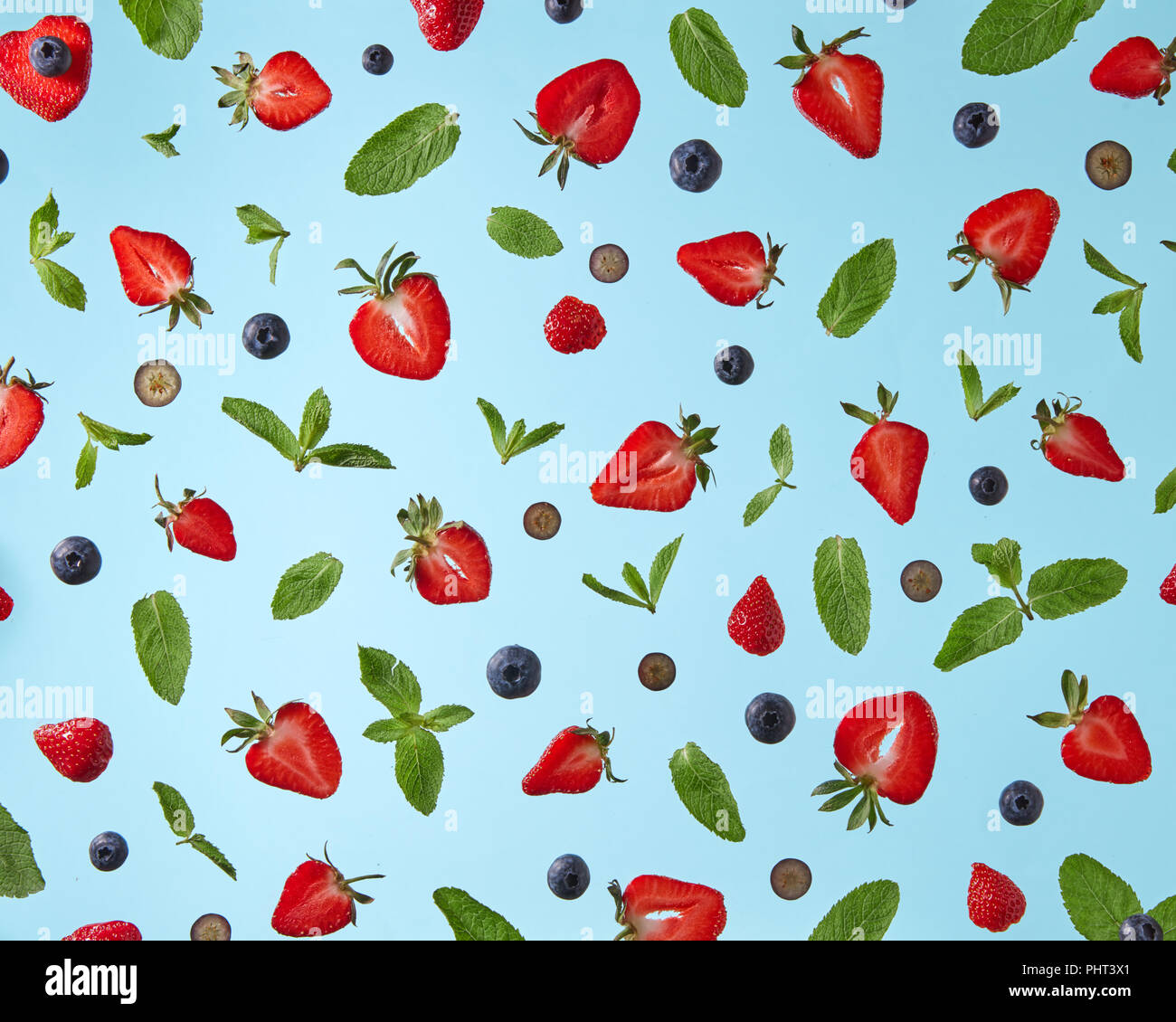 pattern of fresh berries isolated on blue background Stock Photo