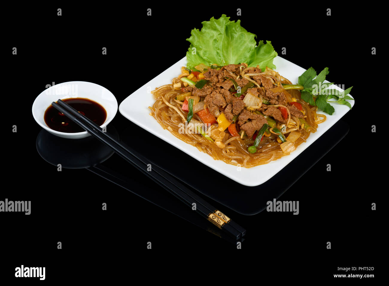 Vietnamese dish Mien Xao Bo is a stirfried glass noodles with beef and vegetables Stock Photo