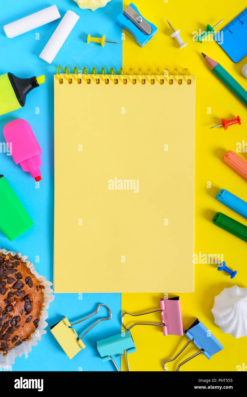 School accessories on a yellow-blue bright background. Back to ...