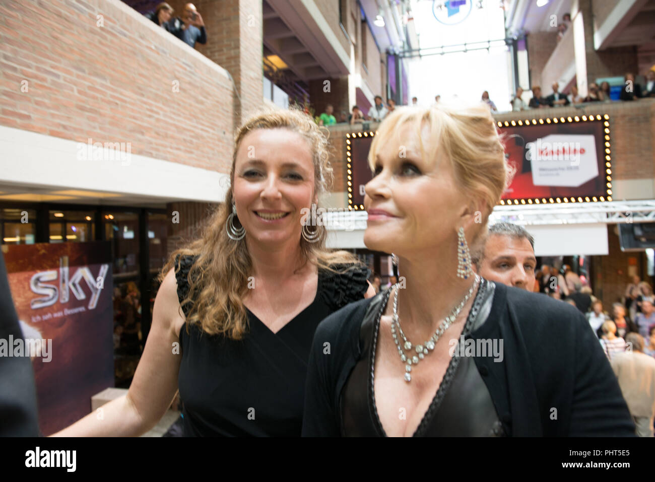 Actress Melanie Griffith arrives at Filmfest München 2012 together with Festival Director Diana Iljine Stock Photo