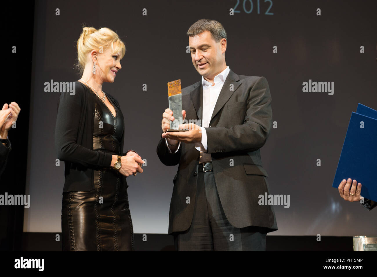 Actress Melanie Griffith receives the CieMerit Award from Markus Söder at Filmfest München 2012 Stock Photo