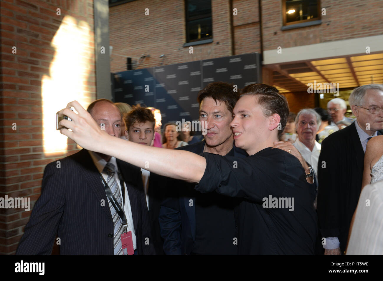 Actor Tobias Moretti taking a selfie with fan at Filmfest München 2015 before the screening of his film 'Luis Trenker' Stock Photo