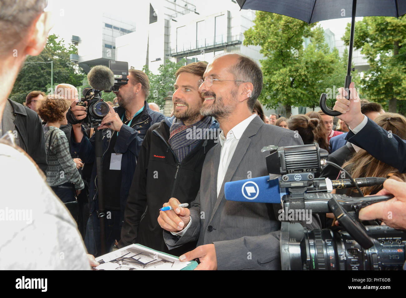 Actor Christoph Maria Herbst gives autographs at Arri Cinema before the screening of his film 'Die kleinen und die Bösen' Stock Photo