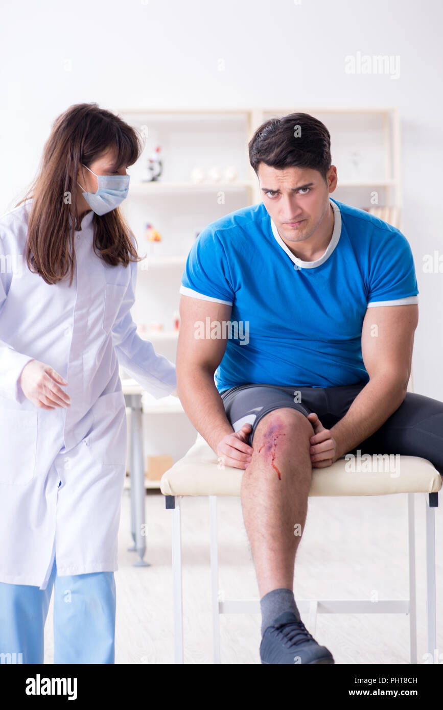 Patient visiting doctor after sustaining sports injury Stock Photo Alamy