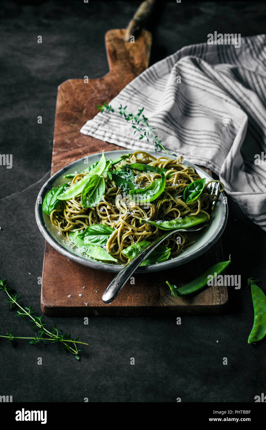 Gluten free spaghetti with snap peas, basil, and thyme Stock Photo - Alamy