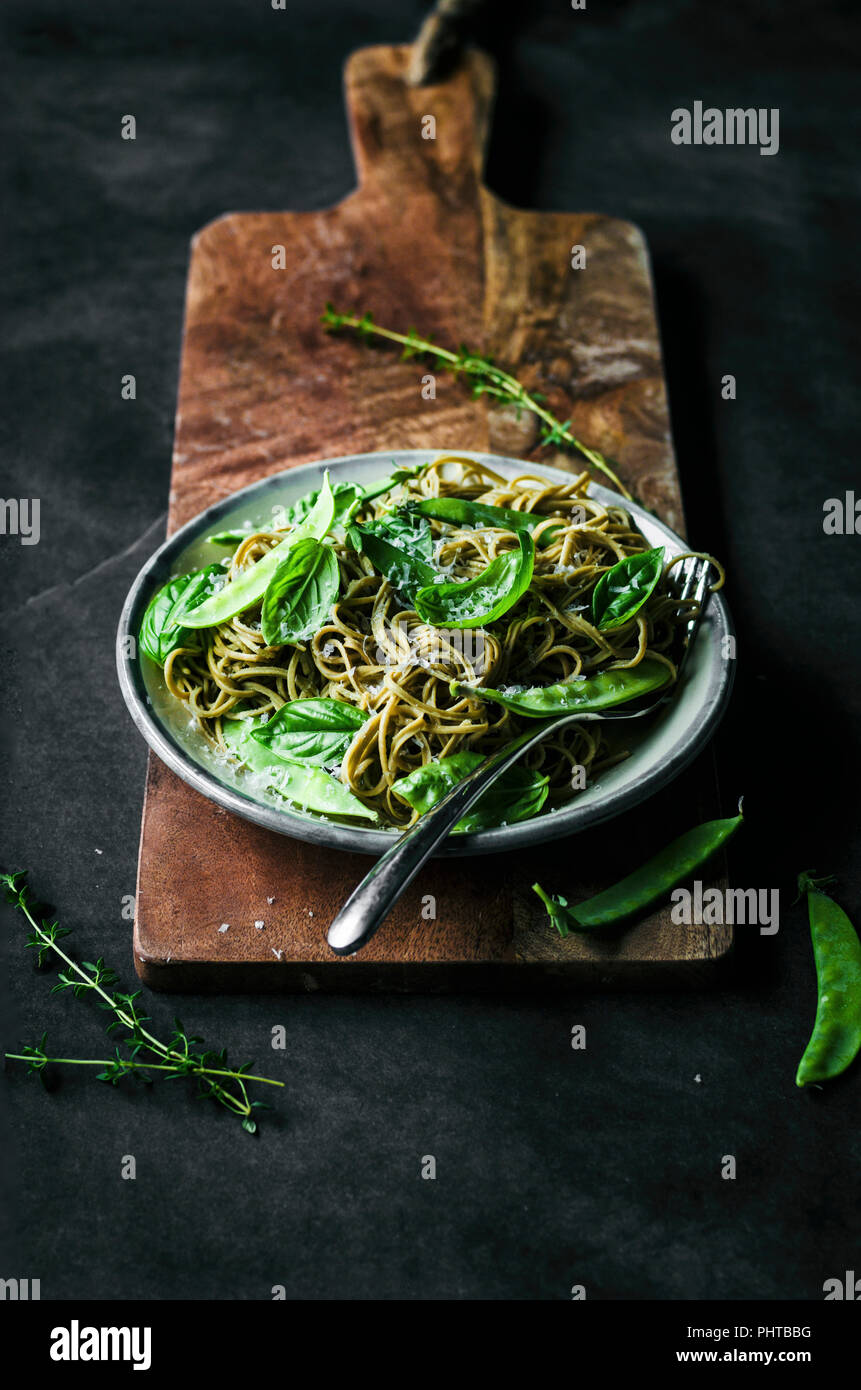 Gluten free spaghetti with snap peas, basil, and thyme Stock Photo Alamy