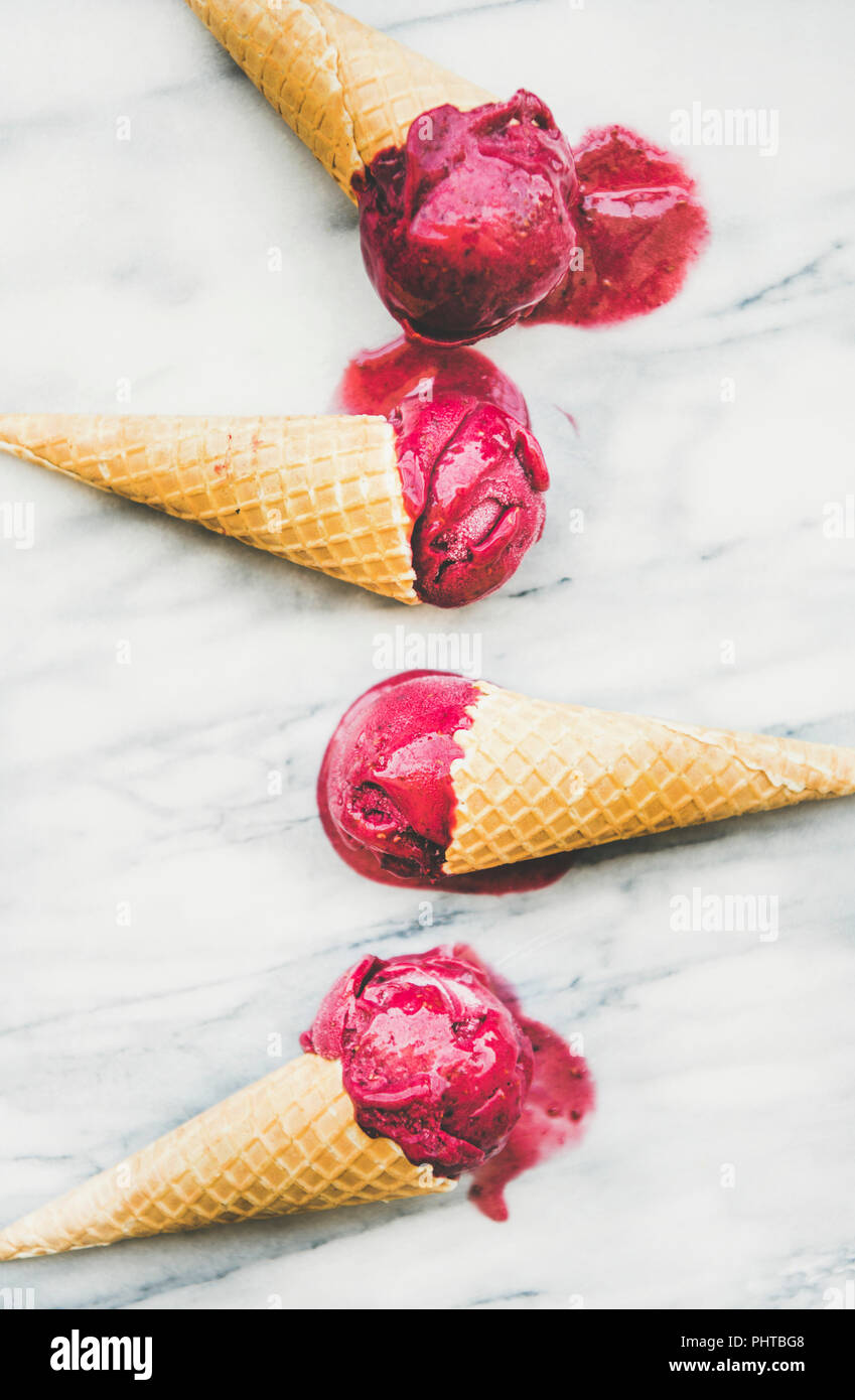 https://c8.alamy.com/comp/PHTBG8/fresh-summer-dessert-flat-lay-of-melting-natural-raspberry-sorbet-ice-cream-scoops-in-sweet-waffle-cones-over-light-marble-background-top-view-vert-PHTBG8.jpg