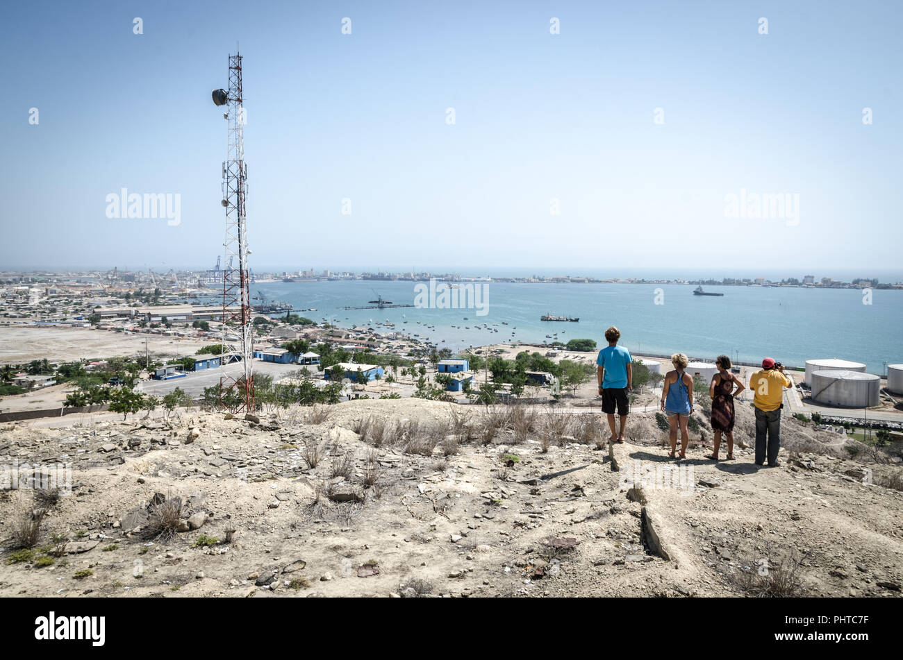 Radio antenna with the Atlantic ocean and people looking in distance, Lobito, Angola. Stock Photo