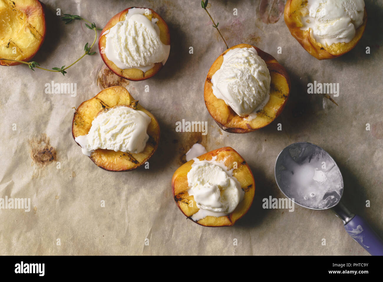Grilled peaches and nectarines served with vanilla ice cream Stock