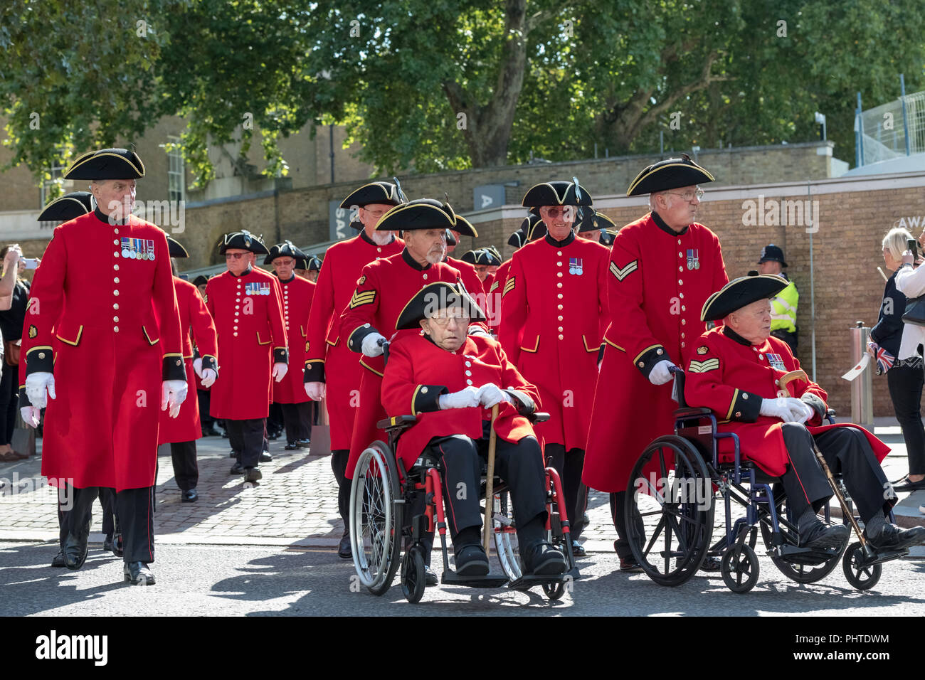 Chelsea Pensioners march on King's Road in London to commemorate the end of the First World War. Stock Photo