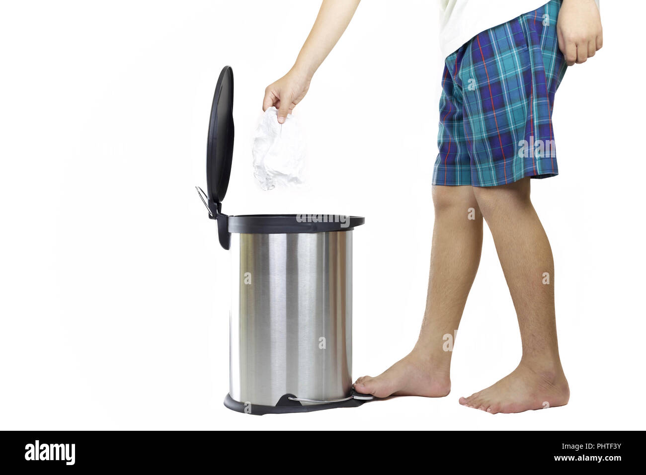 School boy keep clean put tissue paper in rubbish bin Stock Photo Alamy