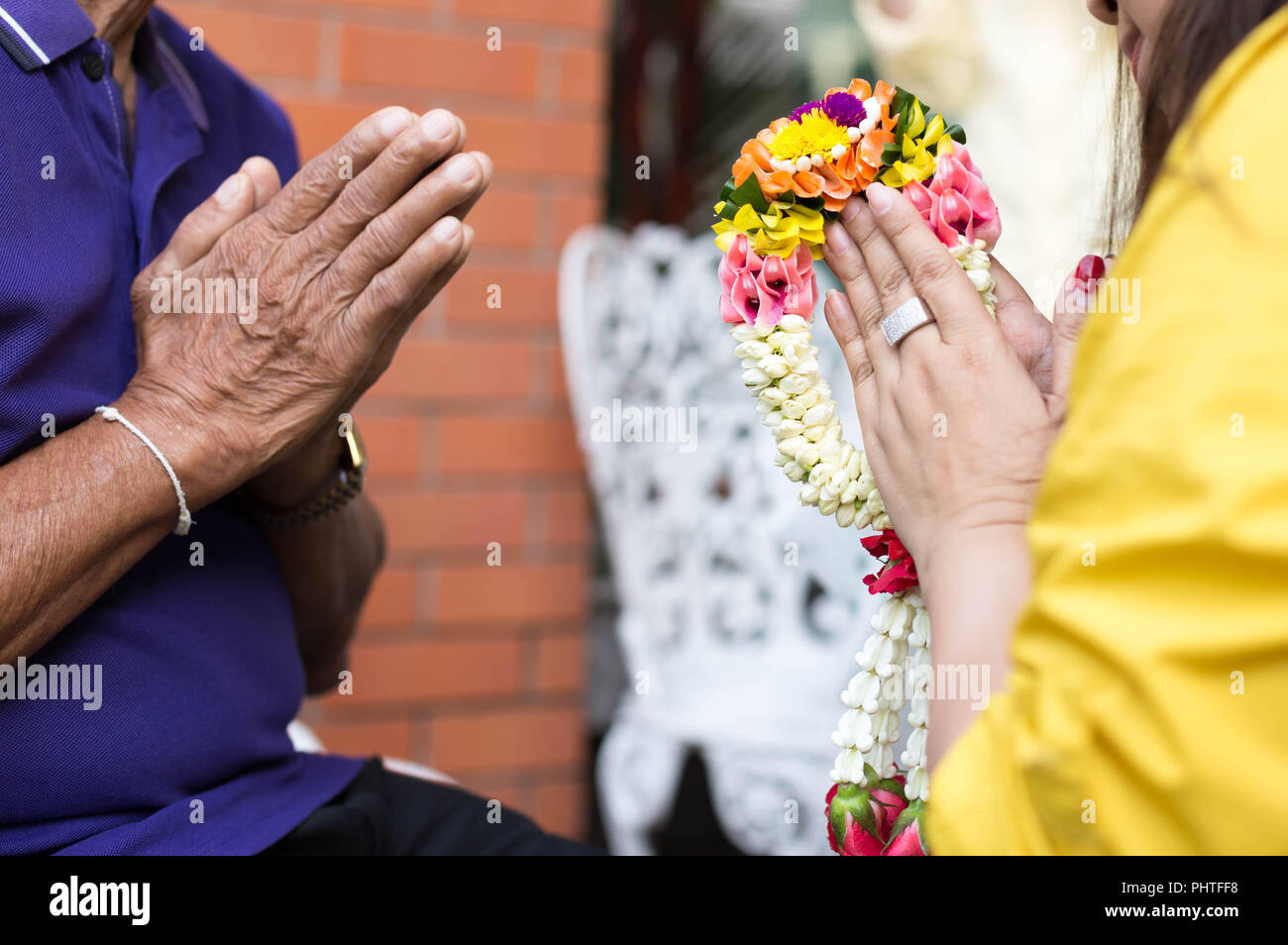 Daughter give jasmine garland to father in fathers day  Stock Photo