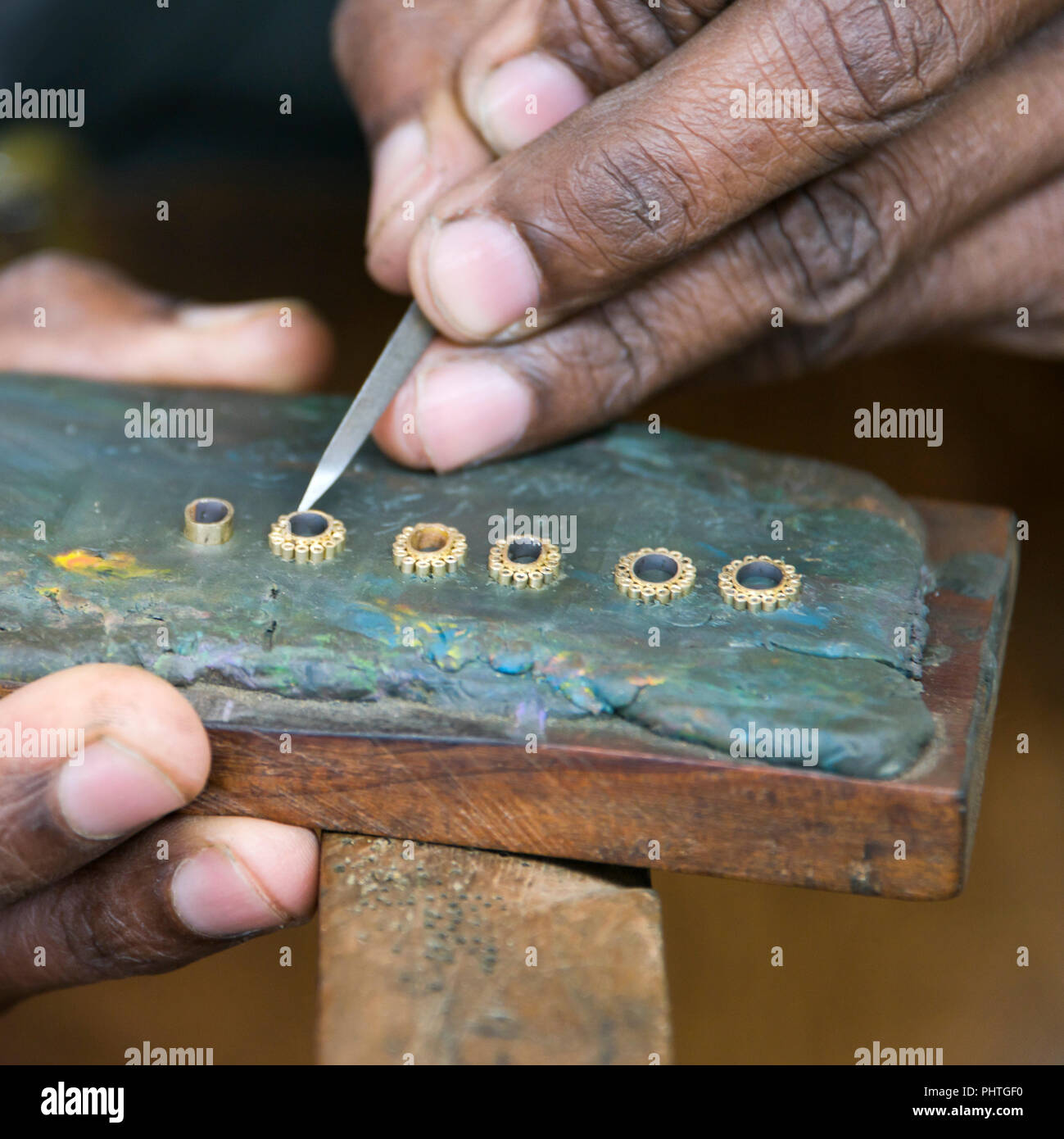 Square portrait of a man making jewellery in Sri Lanka. Stock Photo