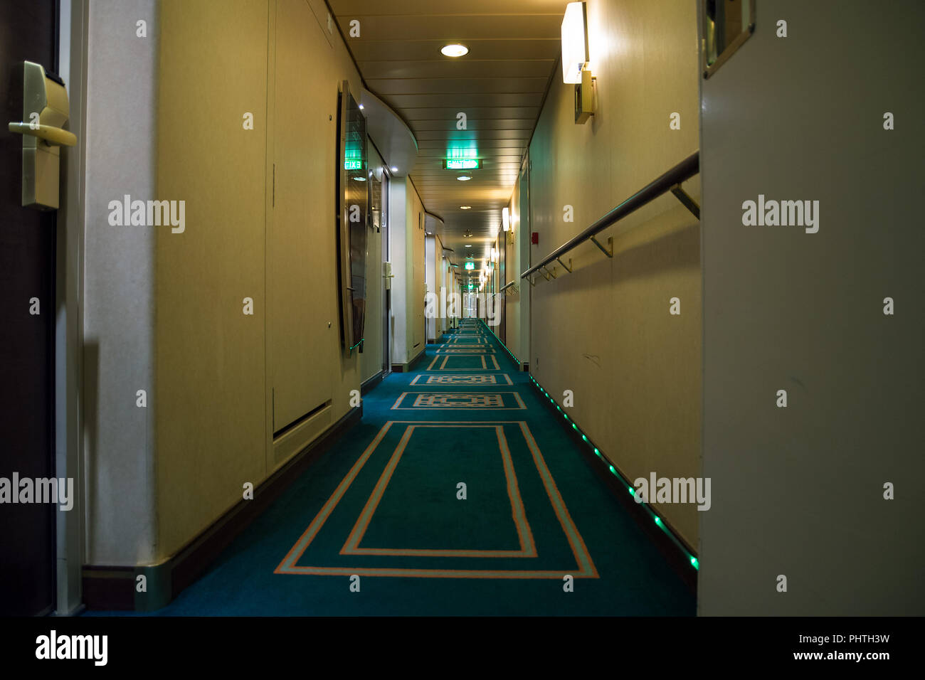 Interior design of passenger deck hallway with living cabins rooms on the board of cruise ship Stock Photo