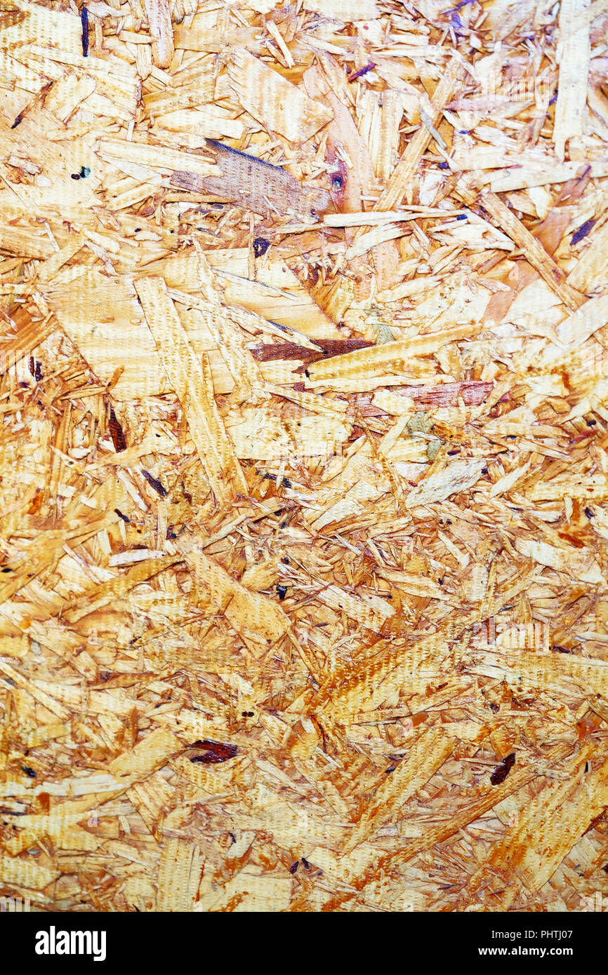 The sheet of pressed sawdust. Sheet of plywood with fragments of ...