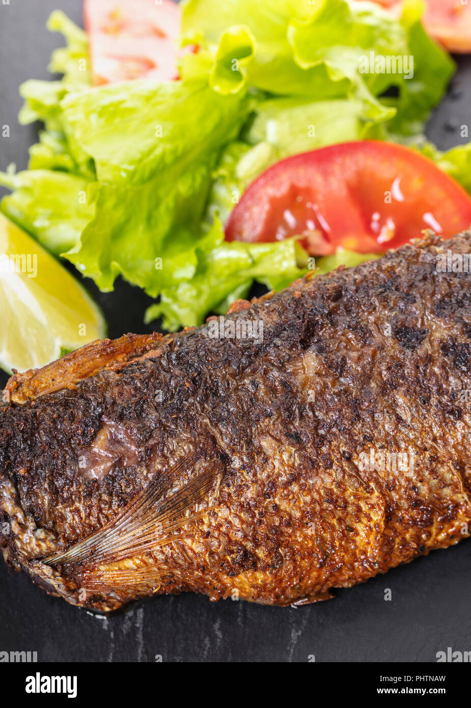 Cooked fish on board hi-res stock photography and images - Alamy