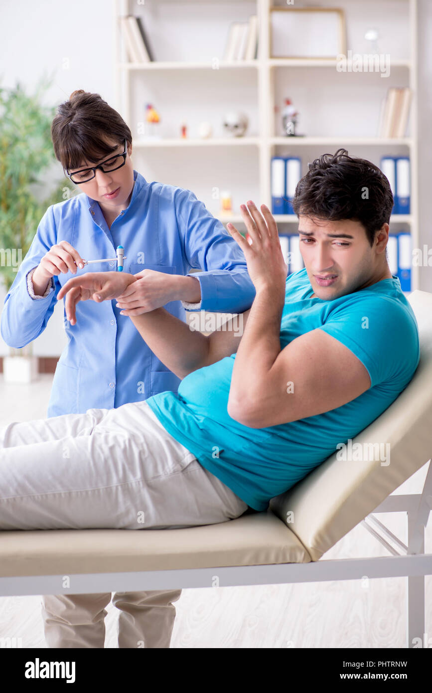 doctor-checking-nerve-reflexes-with-hammer-stock-photo-alamy