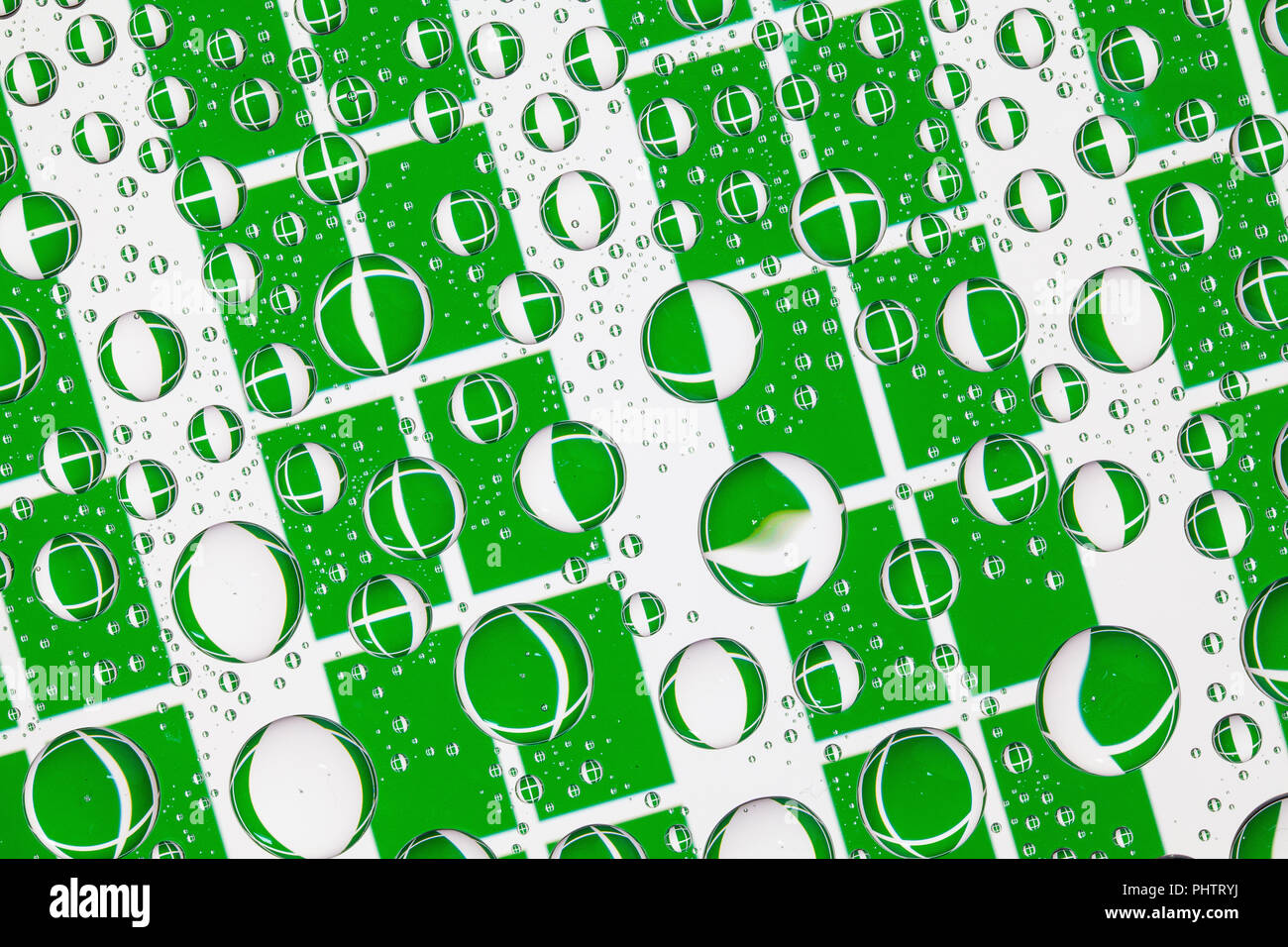 Flags of Nigeria, behind a glass covered with rain drops.Pattern from ...