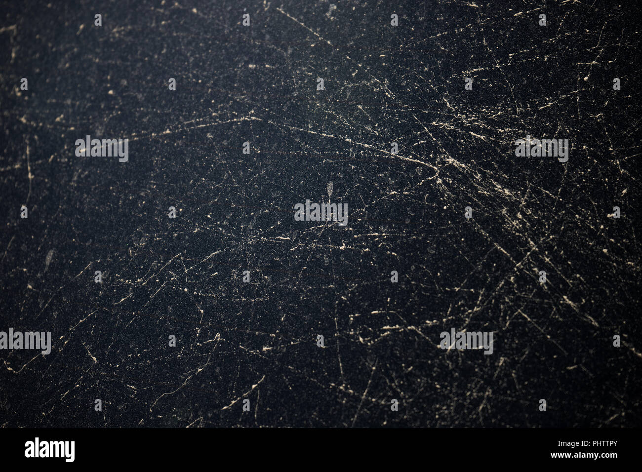 Dust lines on black glass as a abstract background with copy space