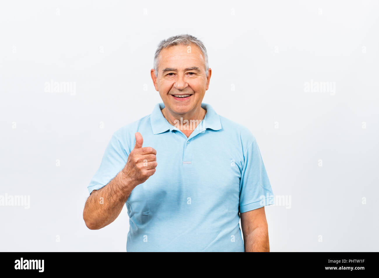 Happy senior man with thumb up Stock Photo - Alamy