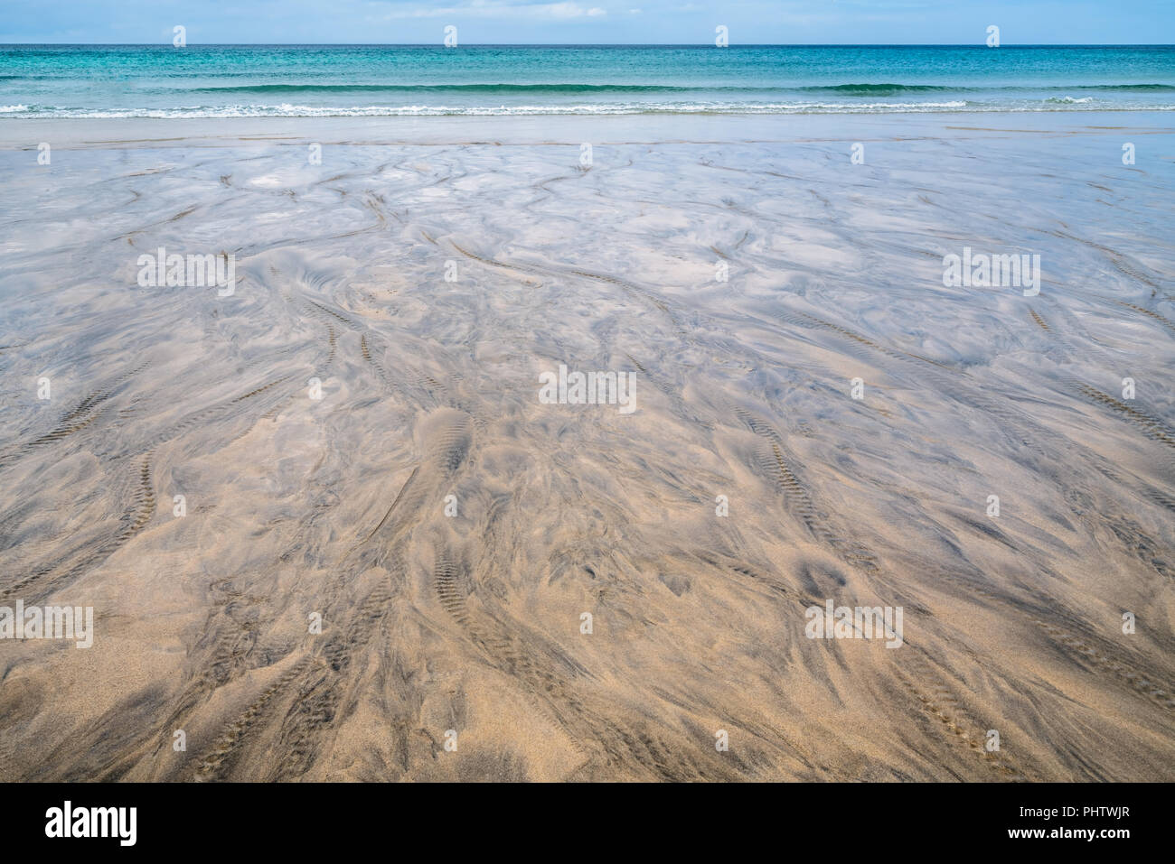 Black patterns on the beach sand Stock Photo