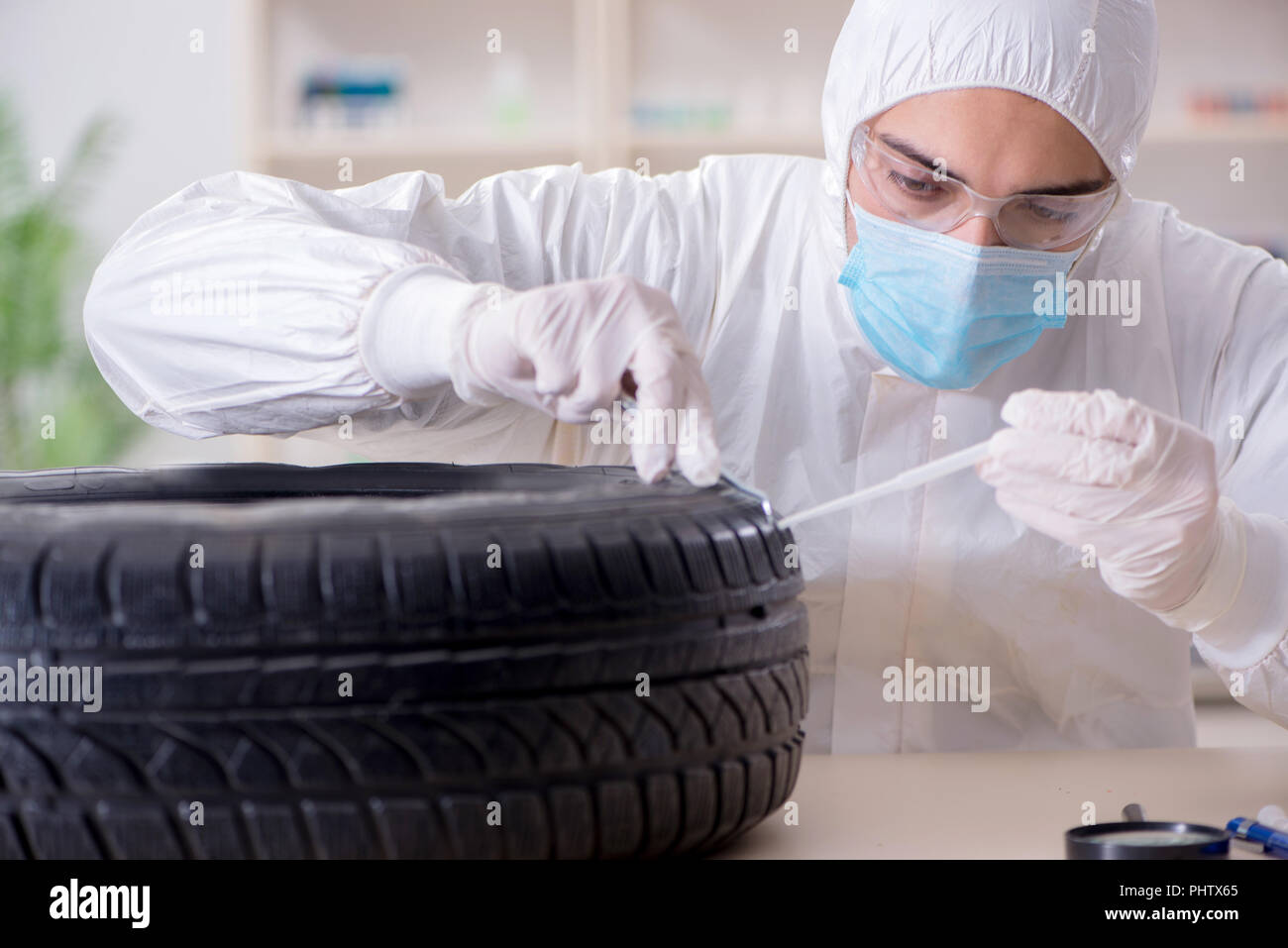 Expert is looking at car accident evidence Stock Photo Alamy
