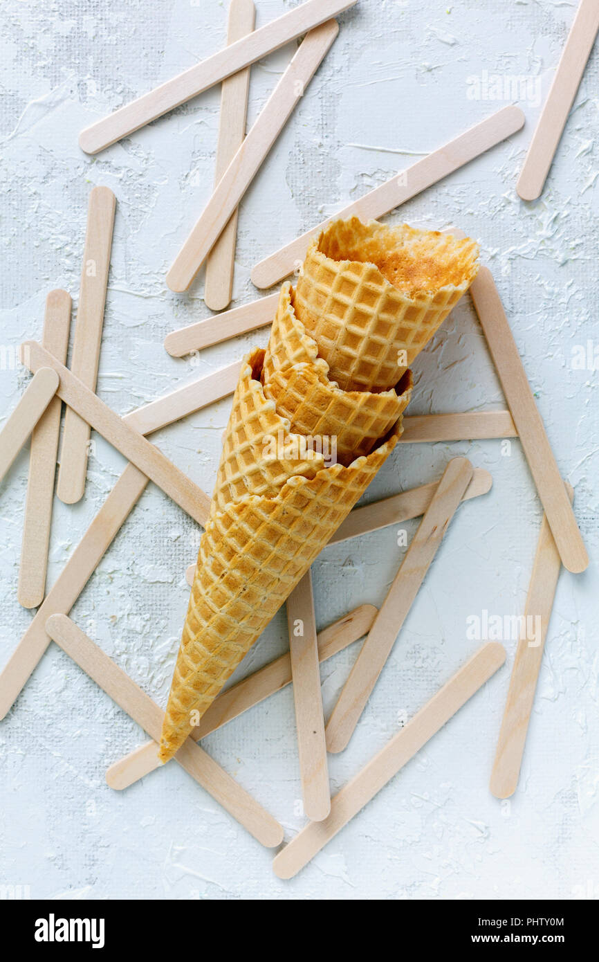 Waffle cones and sticks for ice cream Stock Photo - Alamy