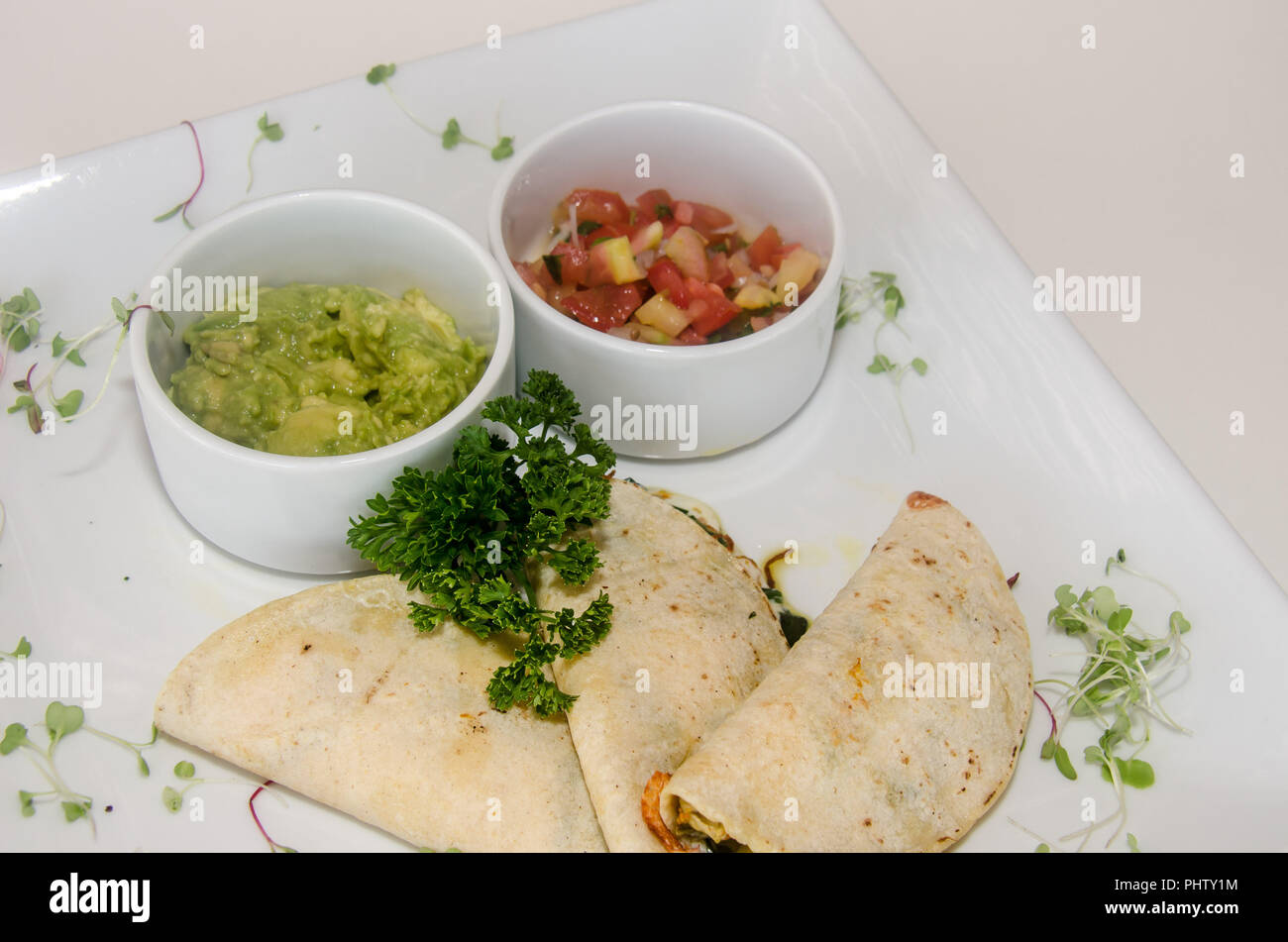 Typical mexican food made with a folded tortilla and filled with