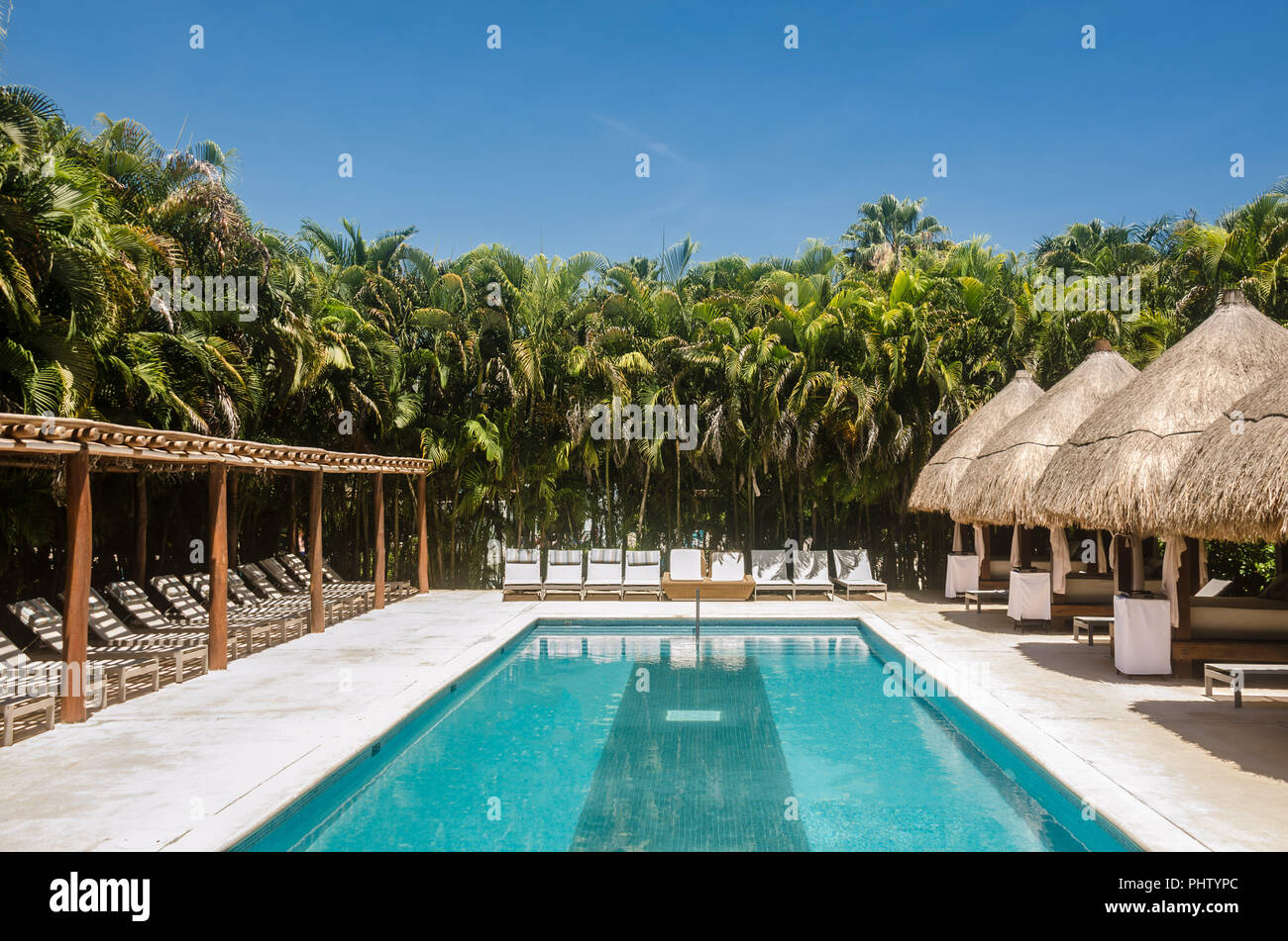 VIP swimming pool area of a mexican caribbean resort Stock Photo - Alamy