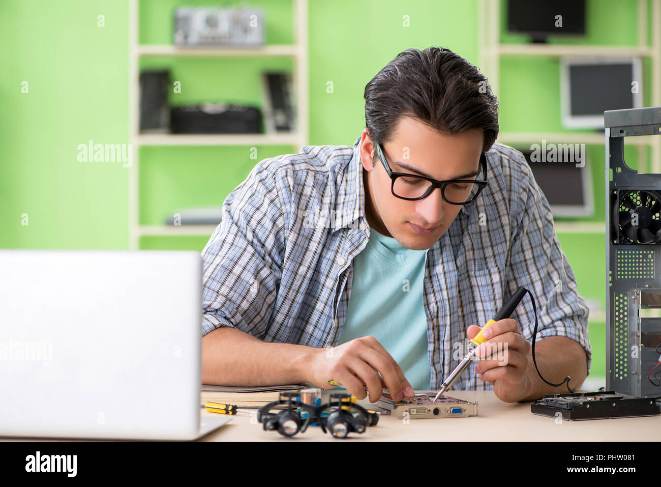 Computer engineer repairing broken desktop Stock Photo - Alamy