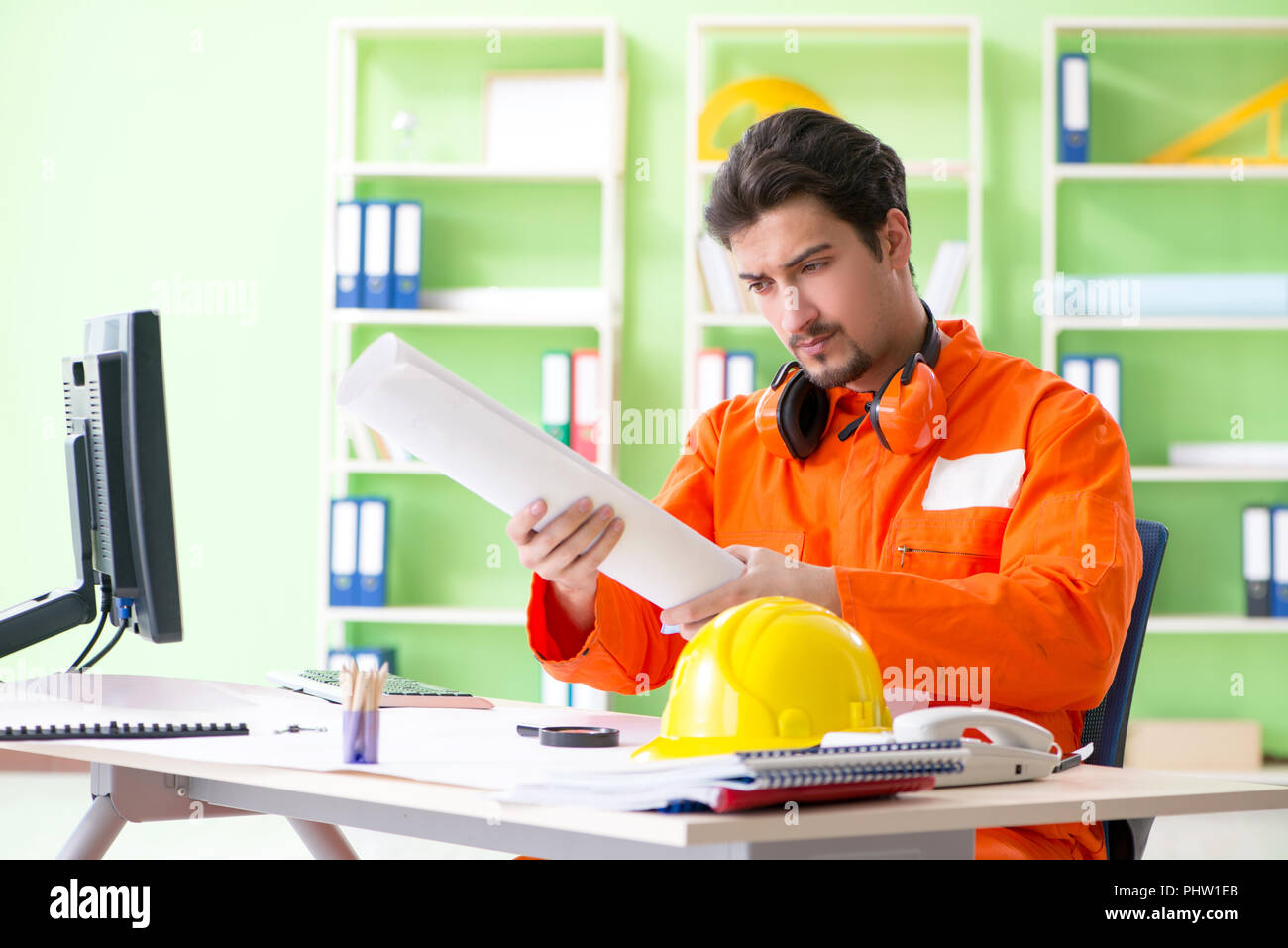 Construction supervisor planning new project in office Stock Photo - Alamy