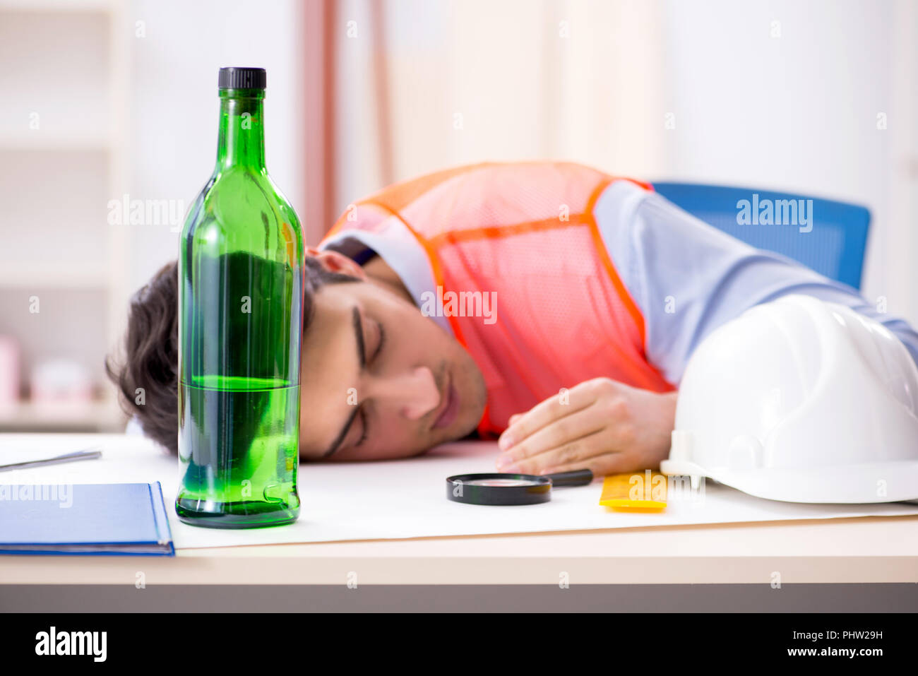 Drunk engineer working in the Stock Photo Alamy