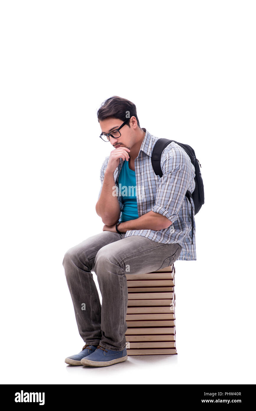 Young student sitting on top of book stack on white Stock Photo - Alamy