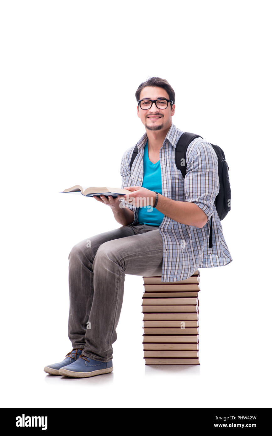 Young student sitting on top of book stack on white Stock Photo - Alamy