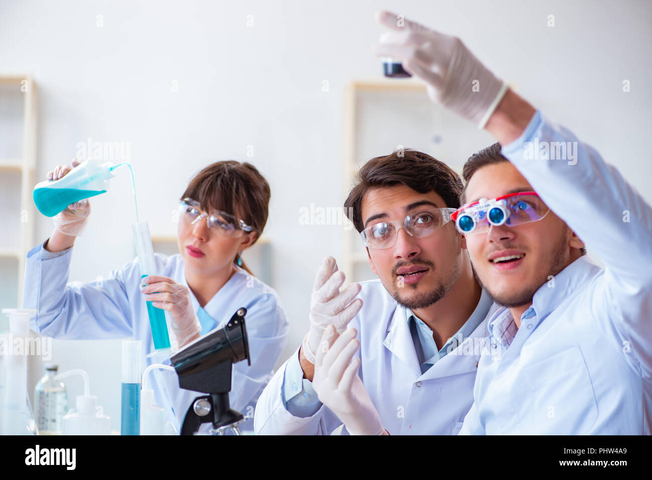 Team of chemists working in the lab Stock Photo