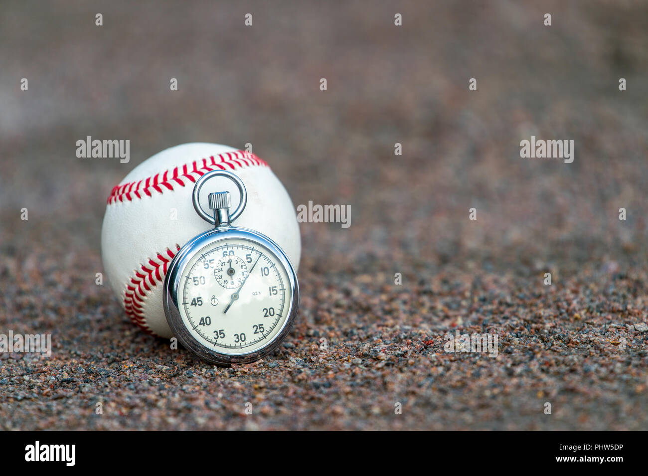 New baseball with an old sport stopwatch Stock Photo Alamy