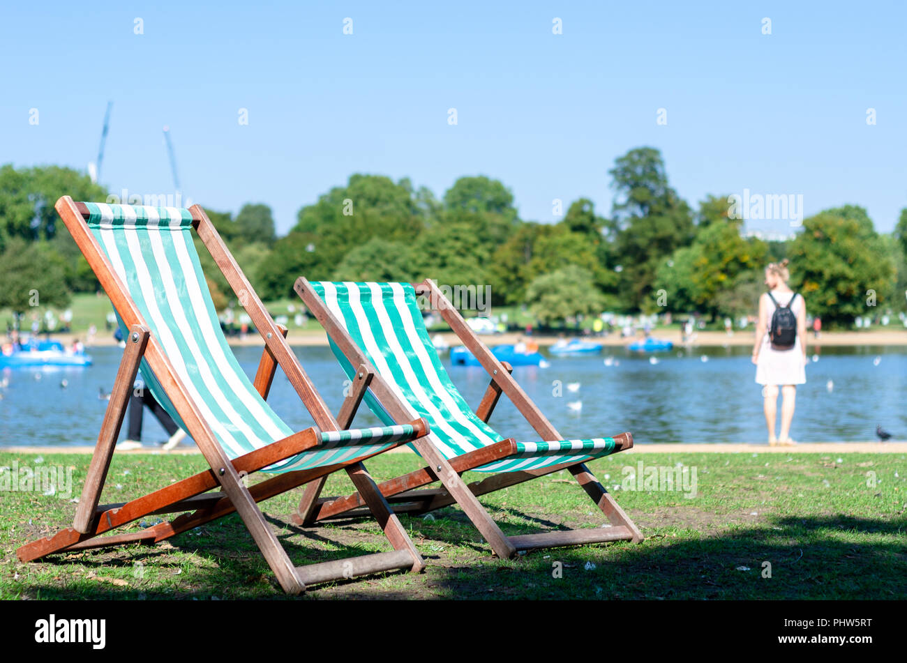 Deck chairs in the park in summertime Stock Photo Alamy