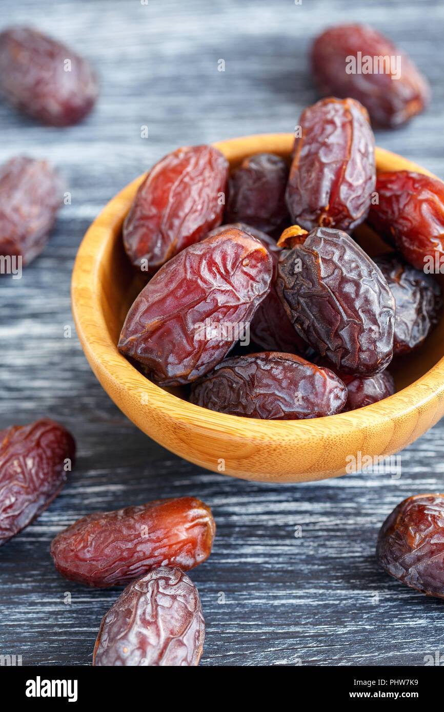 Bowl with sun-dried dates. Stock Photo